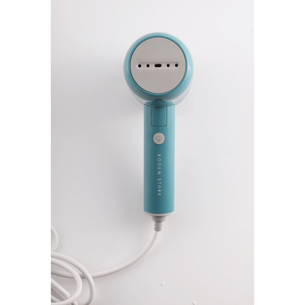 Boden Stark Handheld Steamer in vibrant blue with sleek design, perfect for quick and efficient garment steaming.