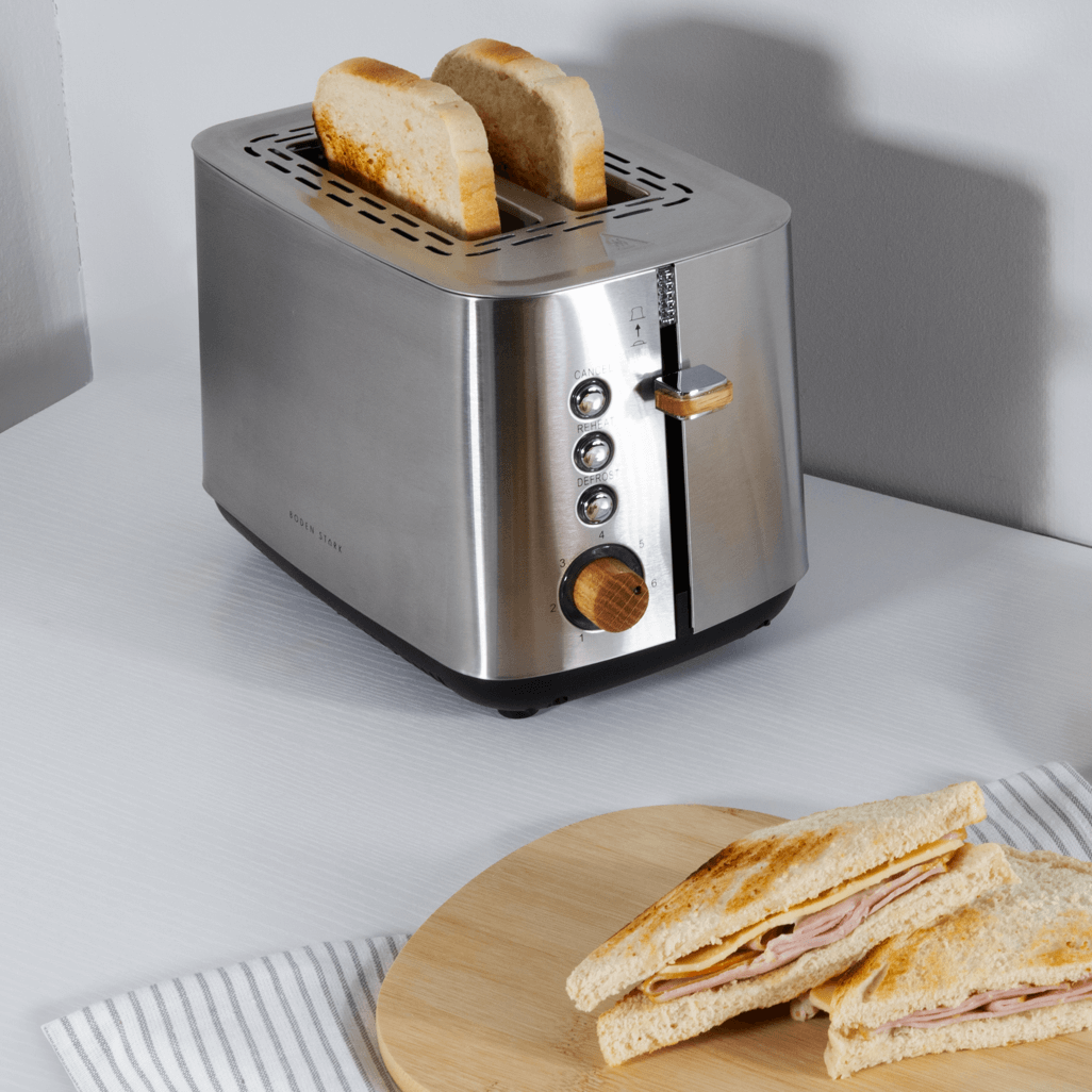 Boden Stark Anson Collection 2 Slice Stainless Steel Toaster with toasted bread on countertop.