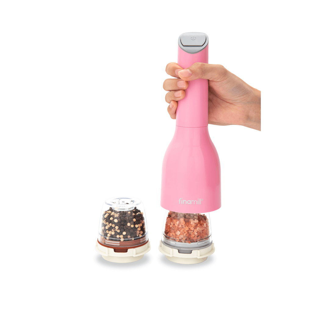 FINAMILL battery-operated pink grinder with interchangeable spice containers in a hand.