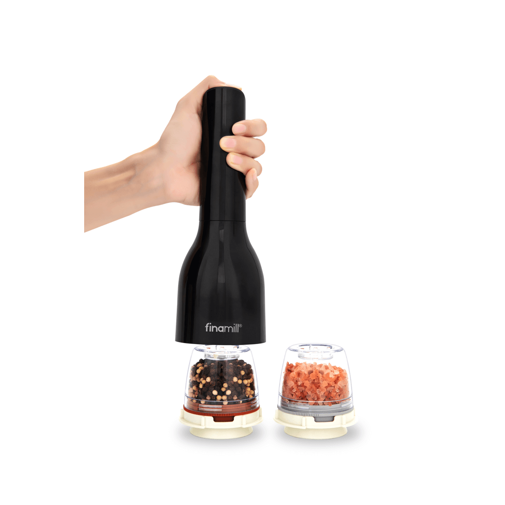 FINAMILL battery-operated grinder in Midnight Black held in hand with spice containers.