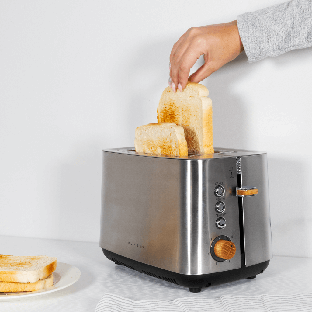 Boden Stark Anson Collection 2 Slice Stainless Steel Toaster with toast, showcasing elegant design and red oak knobs.
