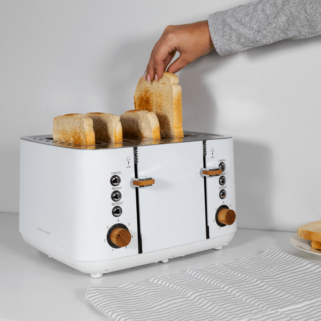 Boden Stark Anson Collection 4 Slice Toaster in white with red oak knobs toasting bread slices.