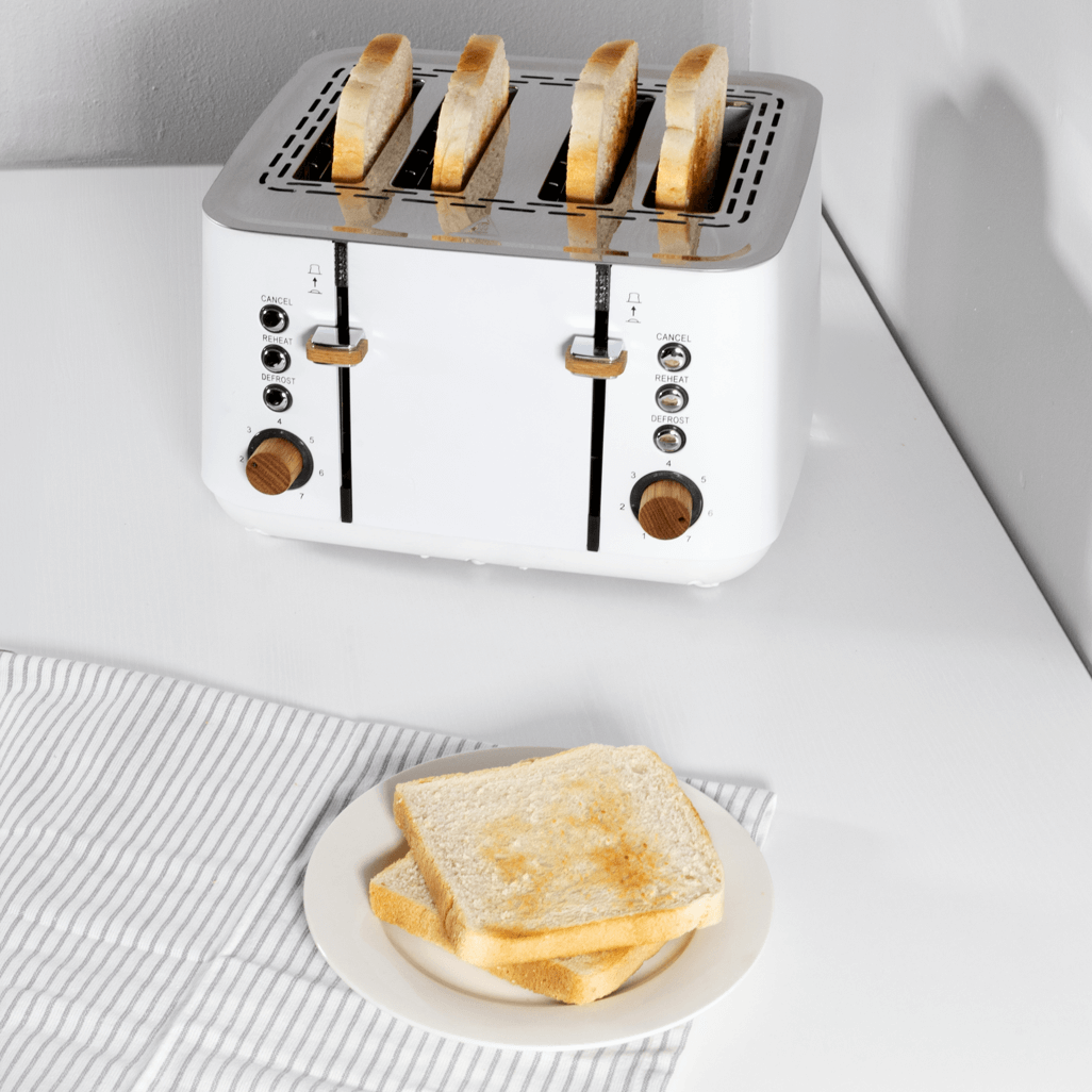 Boden Stark Anson Collection 4 Slice Toaster in white with toasted bread on a plate.