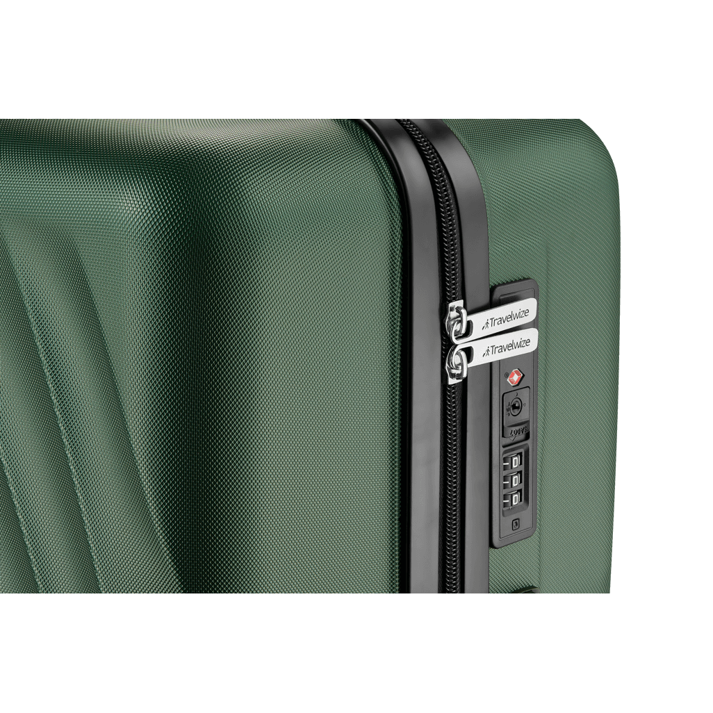 Close-up of Travelwize Terra ABS spinner luggage with black zipper and combination lock, showcasing durable green exterior.