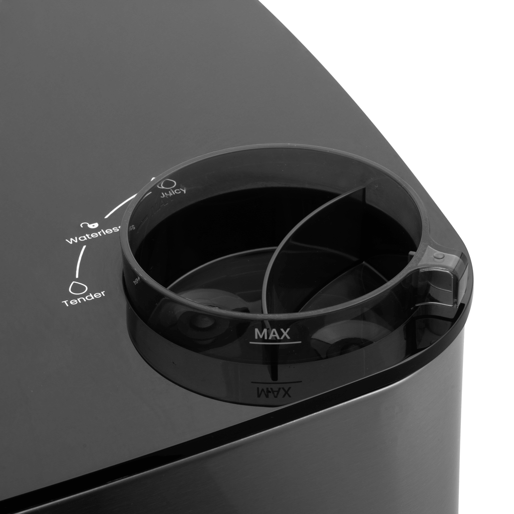 Close-up of Boden Stark 8L Air Fryer's steaming function with measurement markings for water levels.