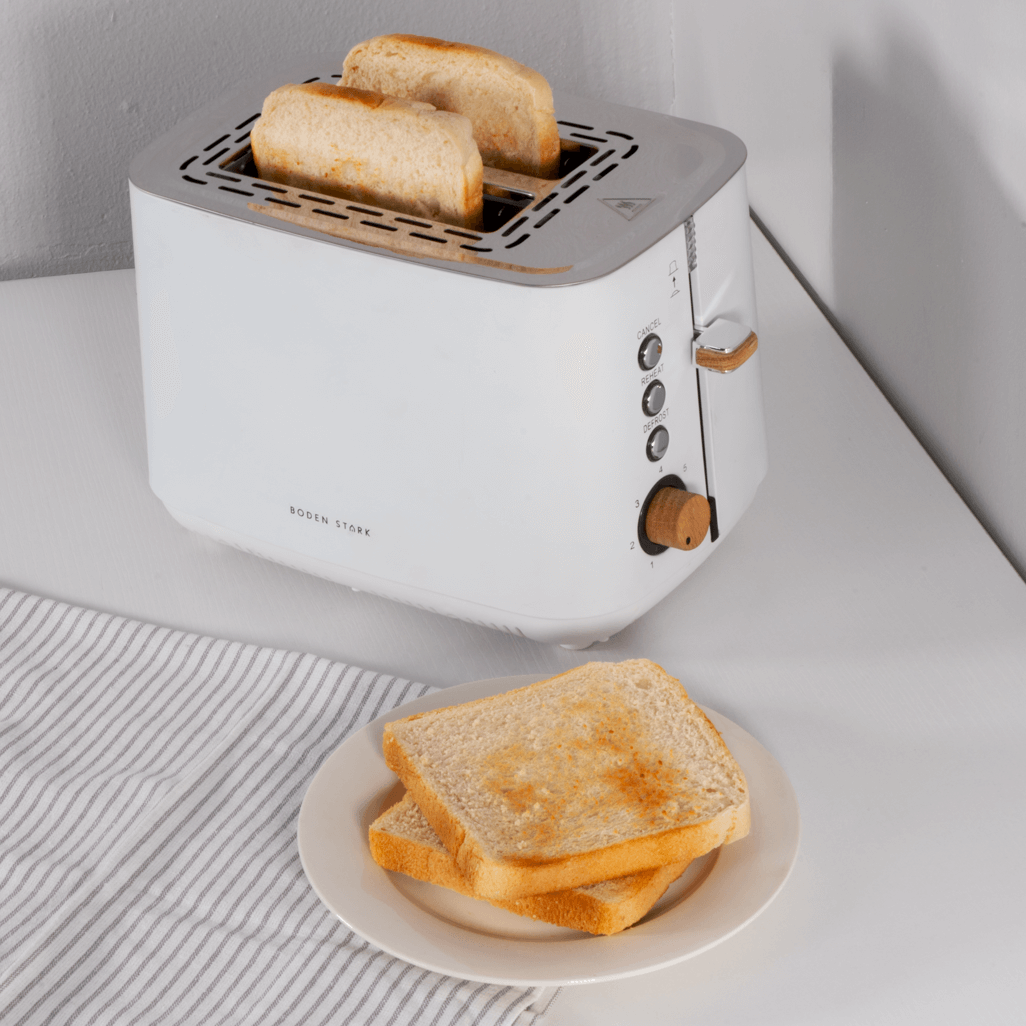 Boden Stark Anson Collection 2 Slice White Toaster with toasted bread on a plate