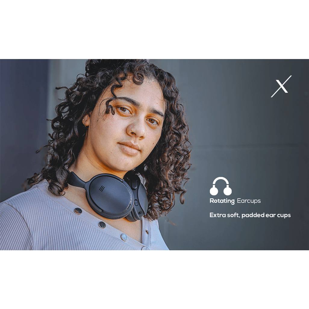 Woman wearing VolkanoX Silenco active noise cancelling headphones with rotating earcups for comfort.