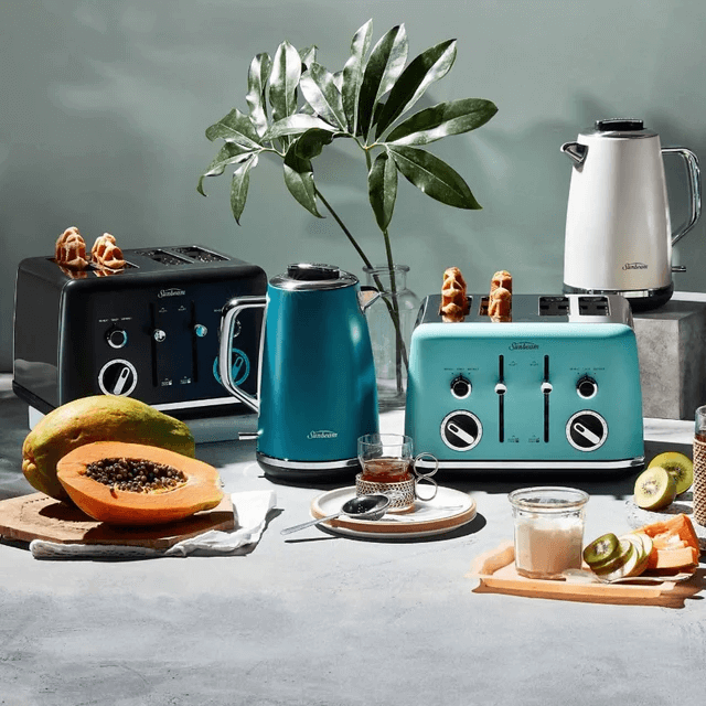 Organic collection of stylish toasters and kettles in black and teal, set against a chic kitchen backdrop.