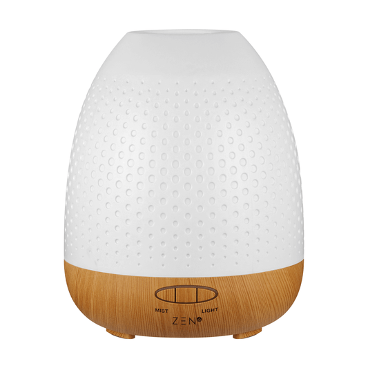 Zen Lunar Diffuser in white with wood base, designed for aromatherapy and ambient lighting.
