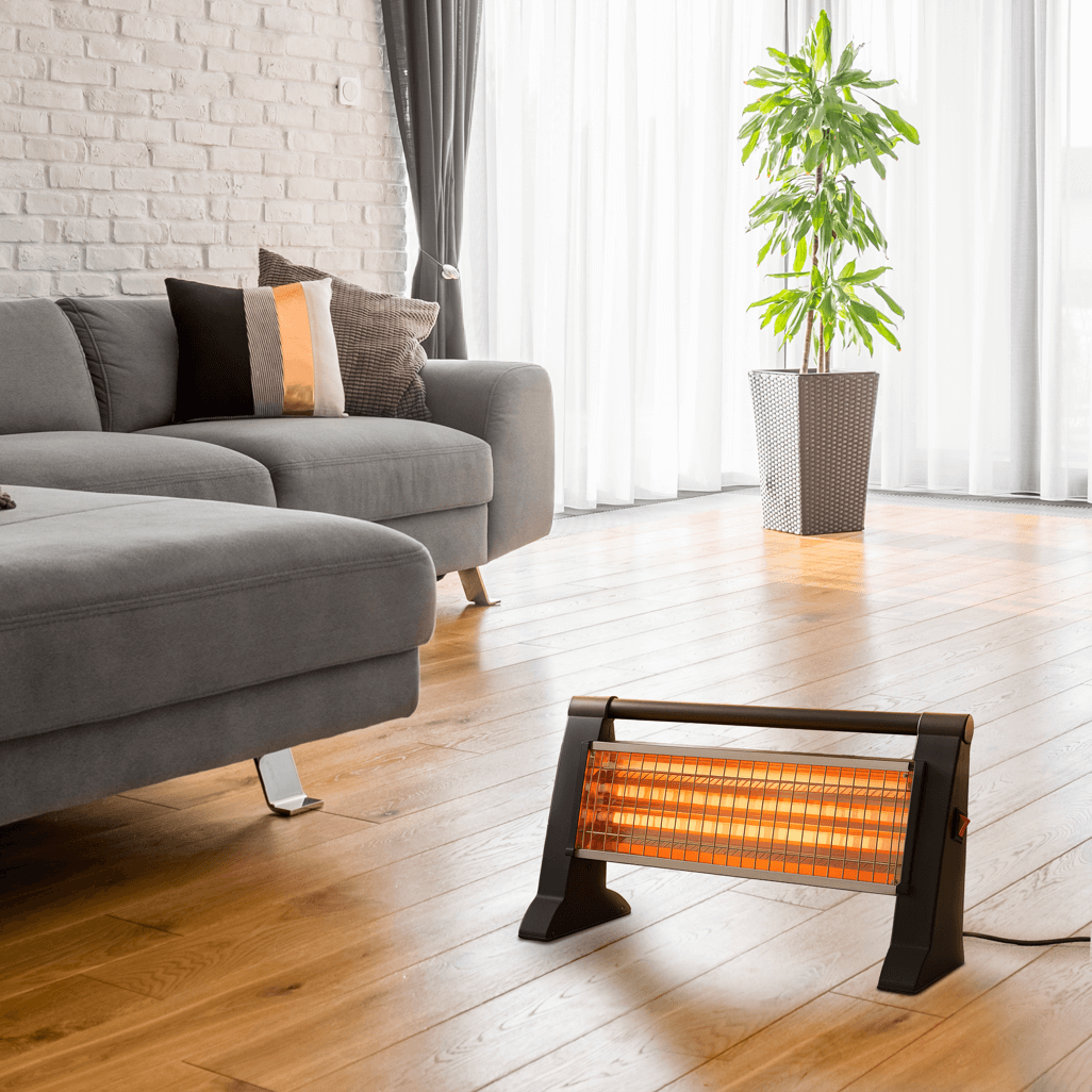 Elektra 3 Bar Heater warming a cozy living room with plush couch and indoor plant.