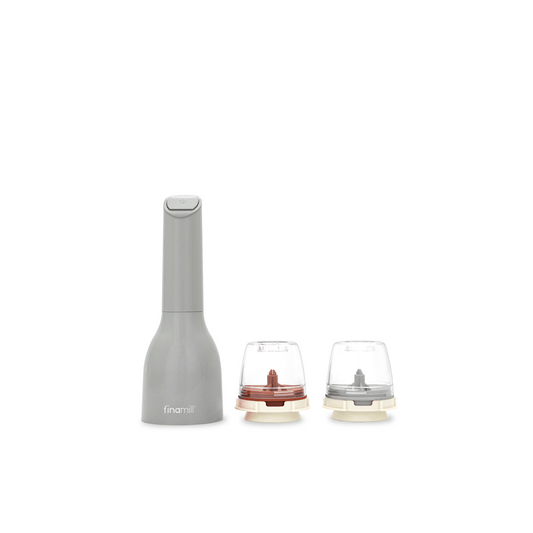 FINAMILL battery-operated grinder with interchangeable grinding cups in gray and clear for versatile spice grinding.
