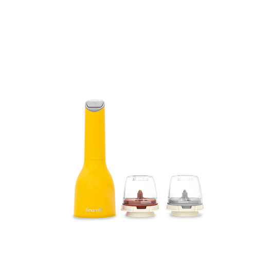 FINAMILL battery-operated grinder in Canary yellow with two interchangeable grinding cups.