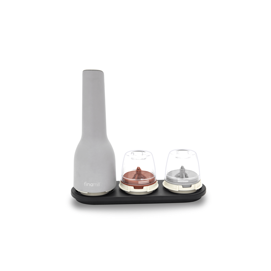FINAMILL rechargeable stone grinder with two colorful containers on a black base for versatile spice grinding.