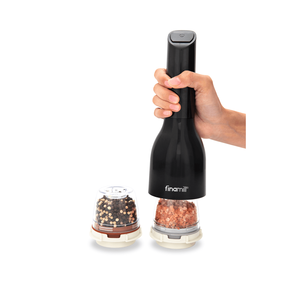 FINAMILL battery operated grinder in Midnight Black, held in hand with spice containers ready for use.