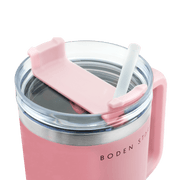 Boden Stark 1200ml pink travel mug with straw lid and silicone grip for easy sipping.