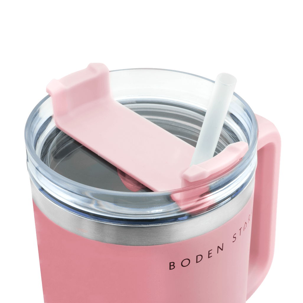 Boden Stark 1200ml pink travel mug with straw lid and silicone grip for easy sipping.