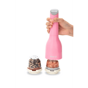 FINAMILL battery-operated pink grinder with interchangeable spice containers in a hand.