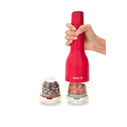 FINAMILL Rechargeable grinder in Sangria color, held by hand, next to spice containers for versatile seasoning.