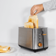 Boden Stark Anson Collection 2 Slice Stainless Steel Toaster with toast, showcasing elegant design and red oak knobs.