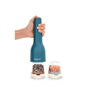 FINAMILL rechargeable grinder in ocean blue, held by a hand, with spice containers beside it.