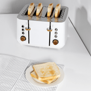 Boden Stark Anson Collection 4 Slice Toaster in white with toasted bread on a plate.
