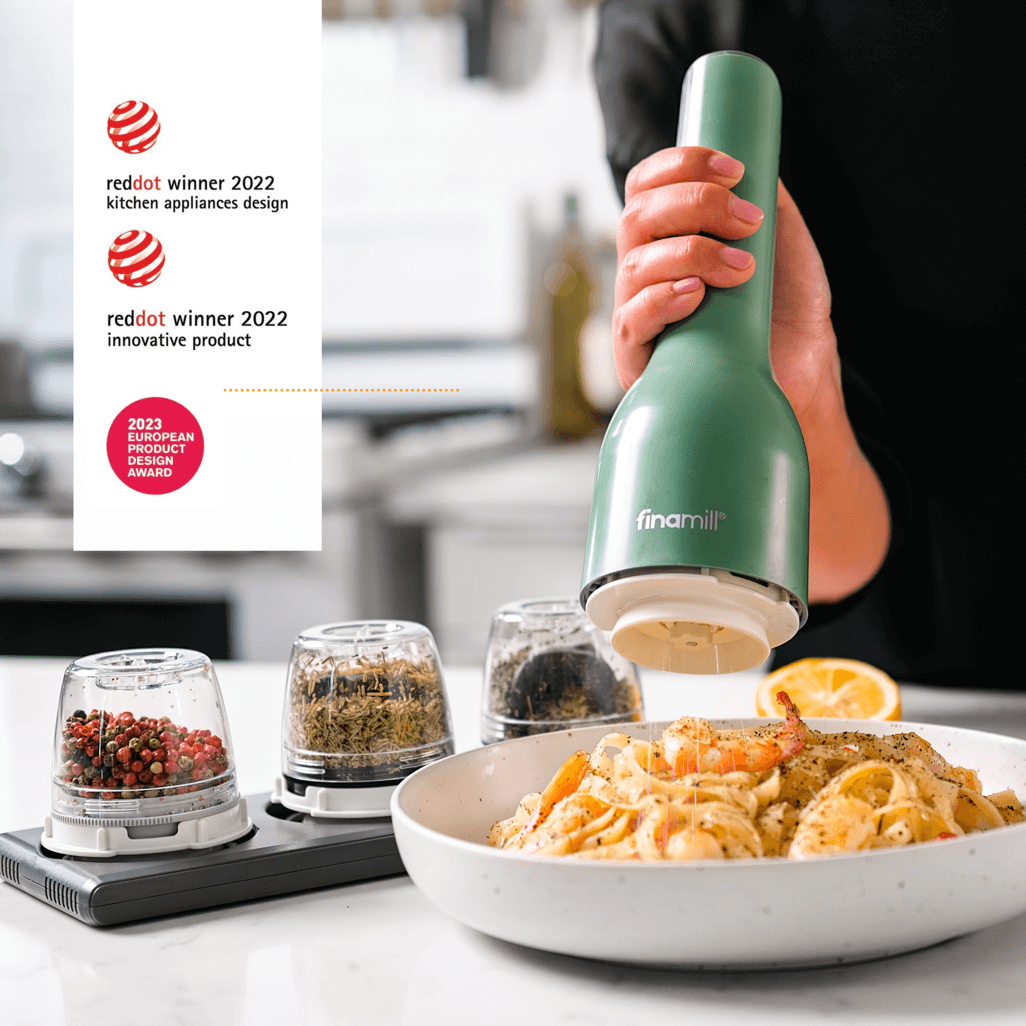 FINAMILL RECHARGEABLE grinder in Sage color, showcasing award-winning design while seasoning a delicious dish.