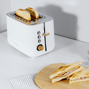 Boden Stark Anson Collection 2 Slice Stainless Steel Toaster in white with toasting bread.