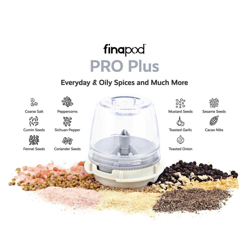 FinaPod Pro Plus spice grinder showcasing various spices like cumin, peppercorns, and sesame seeds.