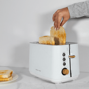 Boden Stark Anson Collection 2 Slice SSToaster White with toasting bread slices, ideal for kitchen use.