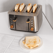 Boden Stark Anson Collection 4 Slice SS Toaster with golden toast on a white plate, showcasing sleek stainless steel design.