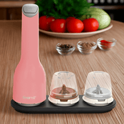 FINAMILL battery operated grinder in pink on a kitchen counter with spice containers neatly arranged.