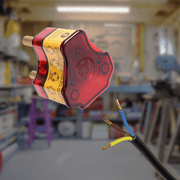 Ellies re-wireable high surge plug top with exposed wires in a workshop setting.