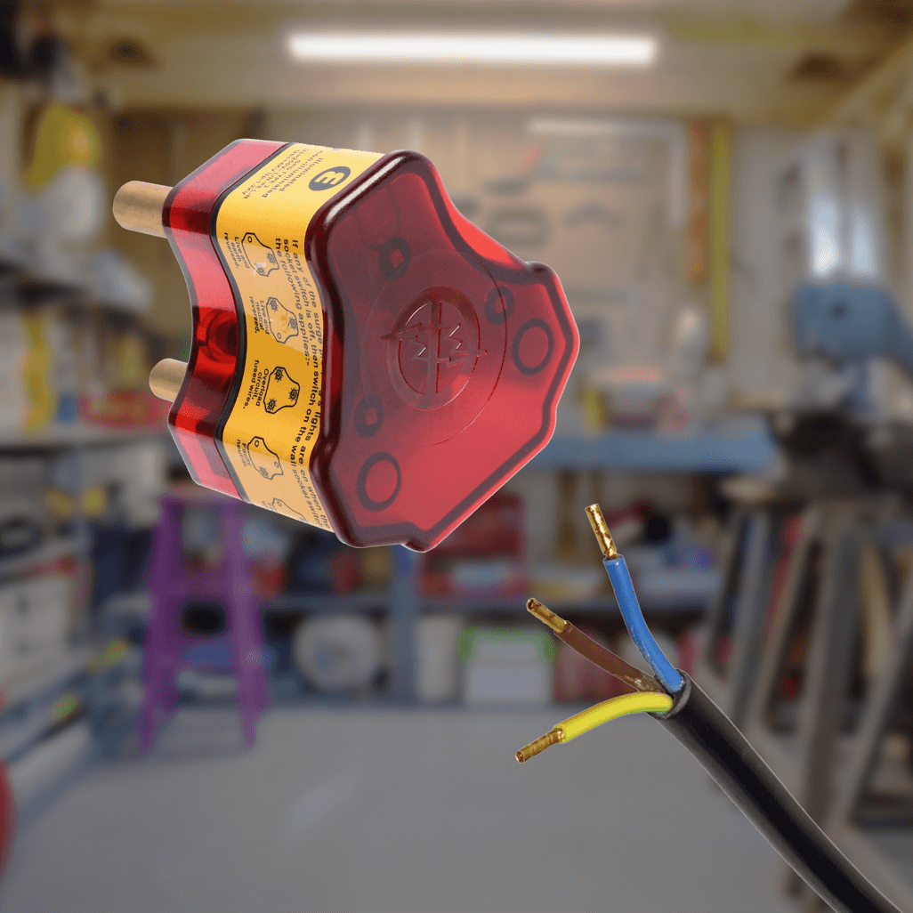 Ellies re-wireable high surge plug top with exposed wires in a workshop setting.