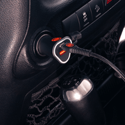 Rugged by Volkano dual USB car charger with QC3.0 and PD plugged into a vehicle's power outlet.