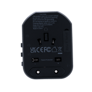 Volkano Worldwide Series Travel Adapter back view showing UK CA CEFC compliance details and safety warnings.