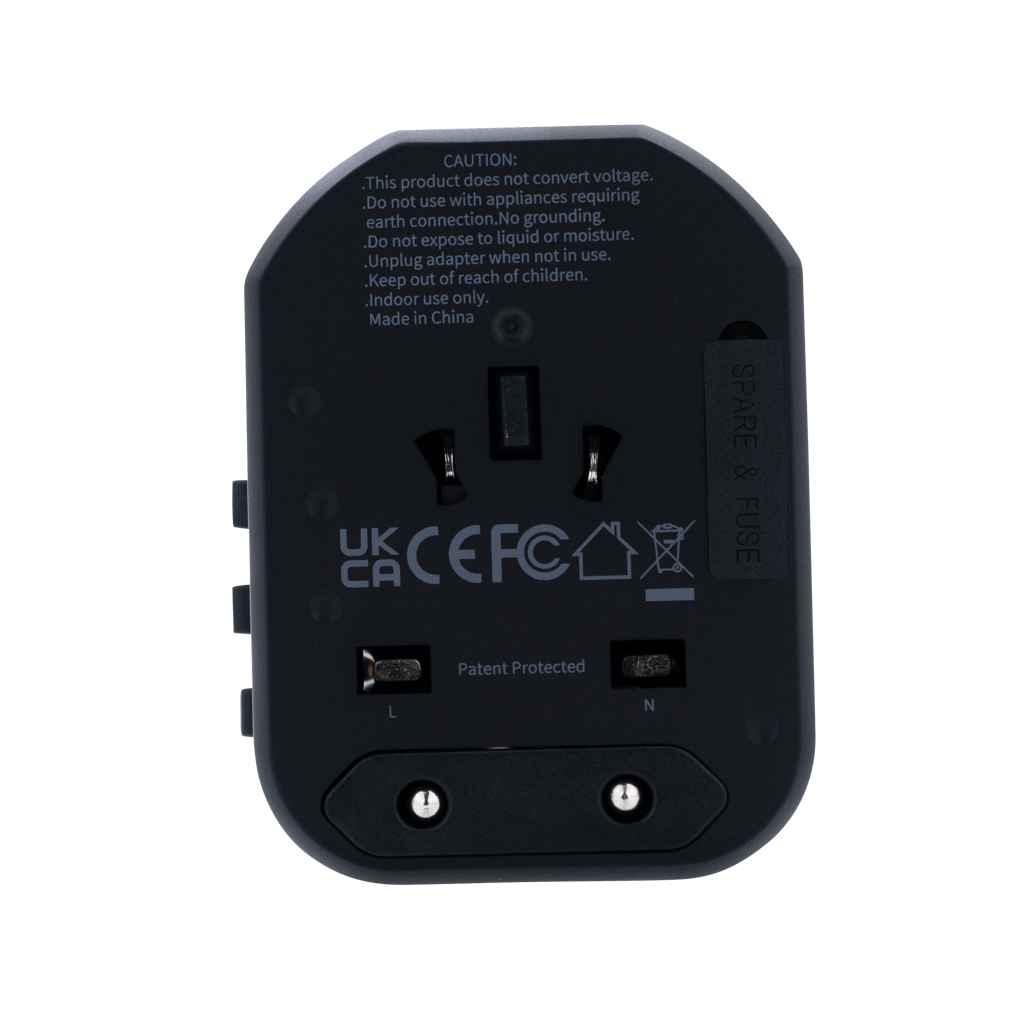 Volkano Worldwide Series Travel Adapter back view showing UK CA CEFC compliance details and safety warnings.